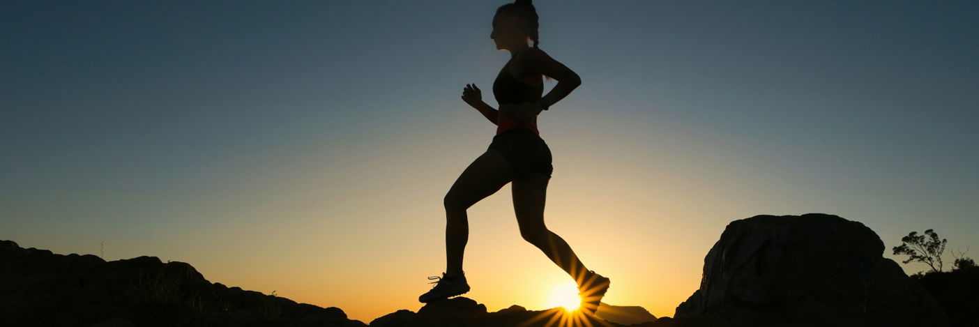 silhouette-of-man-jumping-on-rocky-mountain-during-sunset.jpg silhouette of man jumping on rocky mountain during sunset