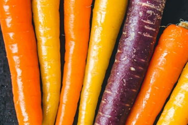 a bunch of carrots are on a tray
